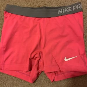 Pinkish Orange Nike Pros - good condition